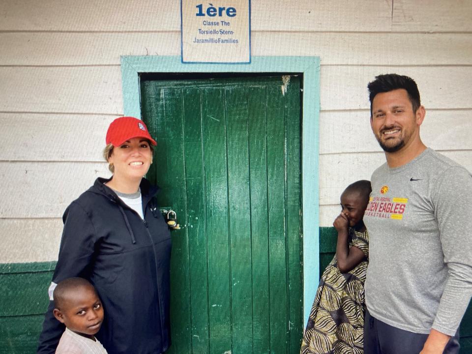 Jackie Jaramillo and Dan Torsiello with students at the school they funded in the Congo.