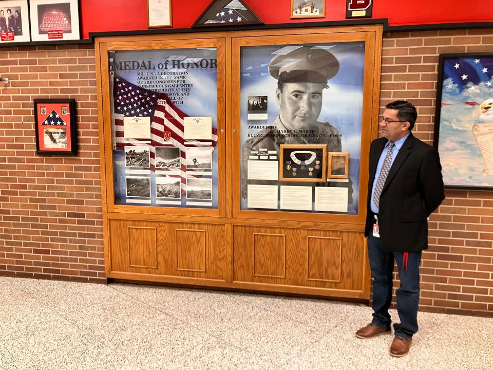 Bucyrus High School Principal Jaivir Singh showing the memorabilia that belonged to Harry Martin including his medal of honor, Friday, Nov. 10, 2023.