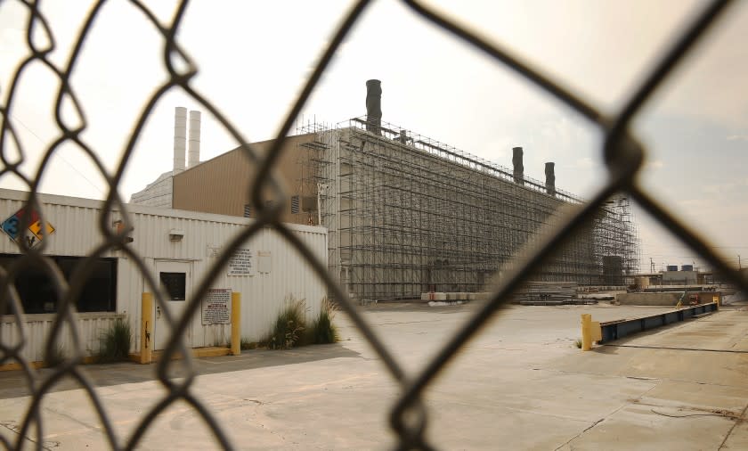 LOS ANGELES, CA - OCTOBER 06: Portions of the Exide Technologies, lead-acid battery recycling plant located in Vernon are wrapped in scaffolding and white plastic even as a press conference with state and local elected leaders was held at Resurrection Church in the Boyle Heights neighborhood of Los Angeles to express their opposition to Exide's proposed bankruptcy settlement, specifically in regard to the option for Exide to fully abandon the facility in Vernon and its responsibility to clean the environmental damage it caused. Resurrection Church on Tuesday, Oct. 6, 2020 in Los Angeles, CA. (Al Seib / Los Angeles Times