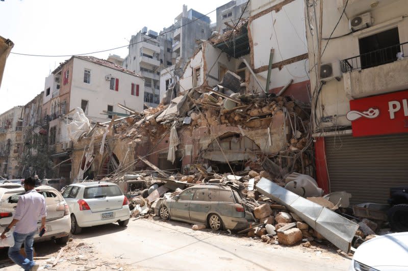 Workers inspect the damage one day after two explosions in Lebanon's capital Beirut on August 5, 2020. File Photo by Ahmad Terro/UPI