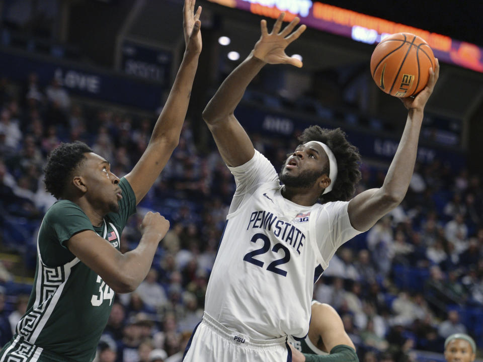 Penn State's Qudus Wahab (22) shoots over Michigan State's Xavier Booker (34) during the first half of an NCAA college basketball game Wednesday, Feb. 14, 2024, in State College, Pa. (AP Photo/Gary M. Baranec