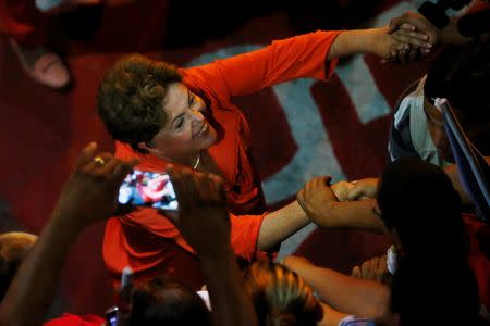 Brazil's President and Workers Party (PT) presidential candidate Dilma Rousseff greets supporters during a campaign rally in Rio de Janeiro September 19, 2014. REUTERS/Ricardo Moraes