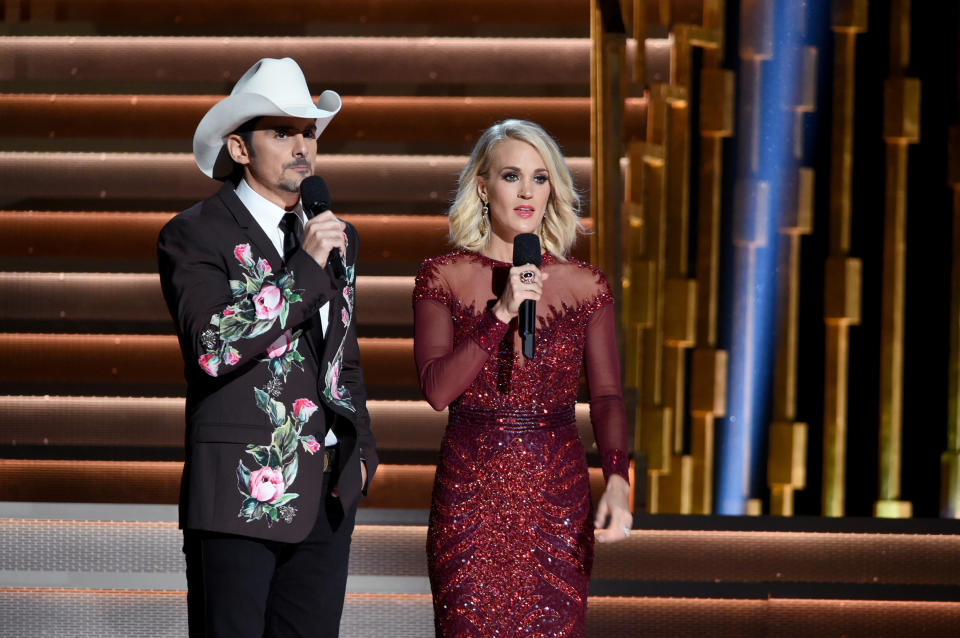 NASHVILLE, TN - NOVEMBER 02:  Hosts Brad Paisley and Carrie Underwood speak onstage at the 50th annual CMA Awards at the Bridgestone Arena on November 2, 2016 in Nashville, Tennessee.  (Photo by Erika Goldring/FilmMagic)