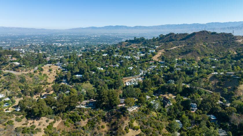 Los Angeles, CA - July 11: New construction of homes is ongoing in the Hollywood Hills, where a critical wildlife corridor connecting Laurel Canyon on right, and Nichols Canyon, left, part of the larger 405 to Griffith Park habitat is threatened on Tuesday, July 11, 2023 in Los Angeles, CA. (Brian van der Brug / Los Angeles Times)