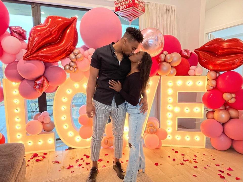 <p>The Olympic gold medalist and the Houston Texans football player shared a smooch in front of an elaborate <a href="https://people.com/sports/simone-biles-celebrates-valentines-day-with-boyfriend-jonathan-owens/" rel="nofollow noopener" target="_blank" data-ylk="slk:Valentine's Day set-up;elm:context_link;itc:0;sec:content-canvas" class="link ">Valentine's Day set-up</a> at Biles's home in Texas. "Lucky to be loved by you," <a href="https://www.instagram.com/p/CLSf3AEB2fH/" rel="nofollow noopener" target="_blank" data-ylk="slk:wrote the gymnast;elm:context_link;itc:0;sec:content-canvas" class="link ">wrote the gymnast</a>. </p>