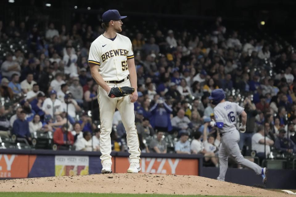 Milwaukee Brewers' Eric Lauer reacts after giving up a home run to Los Angeles Dodgers' Will Smith during the third inning of a baseball game Tuesday, May 9, 2023, in Milwaukee. (AP Photo/Morry Gash)