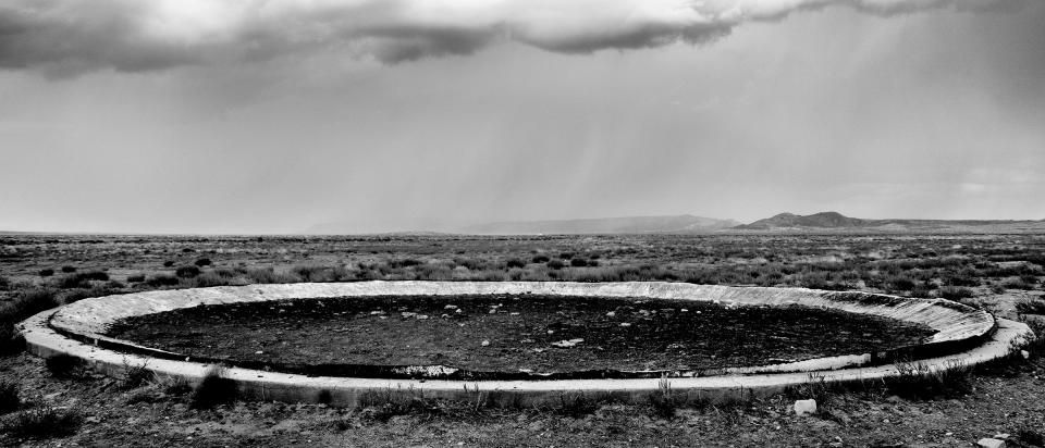 The <a href="https://time.com/longform/clean-water-access-united-states/" rel="nofollow noopener" target="_blank" data-ylk="slk:remains of a water­-storage tank;elm:context_link;itc:0;sec:content-canvas" class="link ">remains of a water­-storage tank</a>, razed because of uranium contamination, in Red Mesa, Ariz.; for decades during the Cold War, mines in the Navajo Nation produced the uranium used for nuclear weapons.<span class="copyright">Matt Black—Magnum Photos for TIME</span>