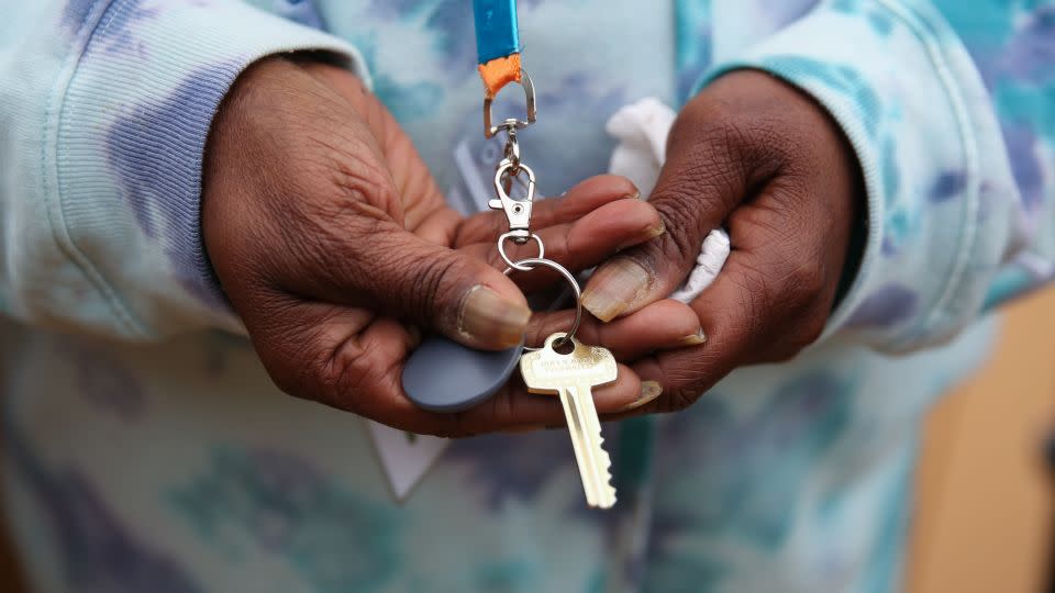 Sherlyn Freeman, a tenant at The Melody, shows the key to her unit at the complex. - Austin Steele/CNN