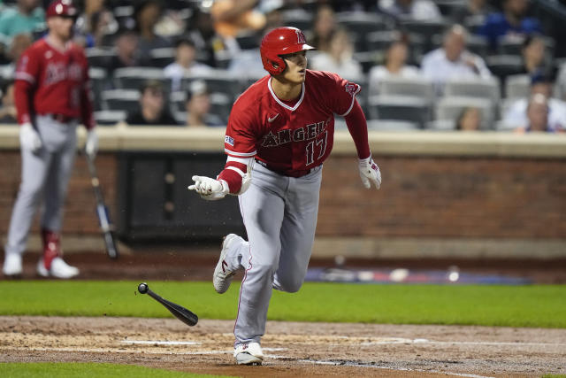 Los Angeles Angels designated hitter Shohei Ohtani arrives in the dugout  before the start of a baseball game against the New York Mets, Saturday,  Aug. 26, 2023, in New York. (AP Photo/Bebeto