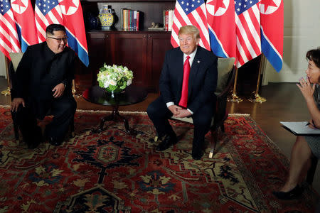 U.S. President Donald Trump and North Korea's leader Kim Jong Un meet in a one-on-one bilateral session at the start of their summit at the Capella Hotel on the resort island of Sentosa, Singapore June 12, 2018. Picture taken June 12, 2018. REUTERS/Jonathan Ernst