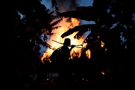 The Wider Image: Fighting fire with fire, Amazon 'forest guardians' stalk loggers