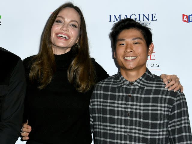 <p>JC Olivera/Getty</p> Angelina Jolie and Pax Thien Jolie-Pitt attend the Los Angeles premiere of MSNBC Films' "Paper & Glue: A JR Project" on November 18, 2021 in Los Angeles, California.