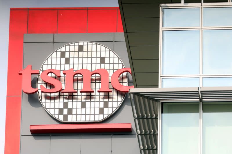 FILE PHOTO: A logo of Taiwan Semiconductor Manufacturing Co (TSMC) is seen at one of its office buildings in Tainan,