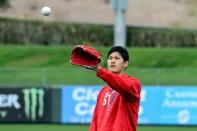 Feb 13, 2018; Tempe, AZ, USA; Los Angeles Angels pitcher Shohei Ohtani plays catch during a workout at Tempe Diablo Stadium. Mandatory Credit: Matt Kartozian-USA TODAY Sports