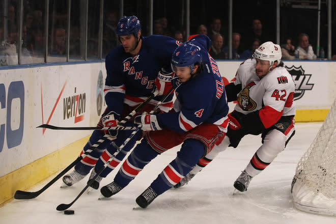 NEW YORK, NY - APRIL 26: Michael Del Zotto #4 and Dan Girardi #5 of the New York Rangers control the puck against Jim O'Brien #42 of the Ottawa Senators in the third period of Game Seven of the Eastern Conference Quarterfinals during the 2012 NHL Stanley Cup Playoffs at Madison Square Garden on April 26, 2012 in New York City. (Photo by Bruce Bennett/Getty Images)