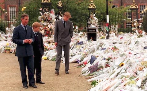 Prince Charles visits flowers outside Kensington Palace with his sons