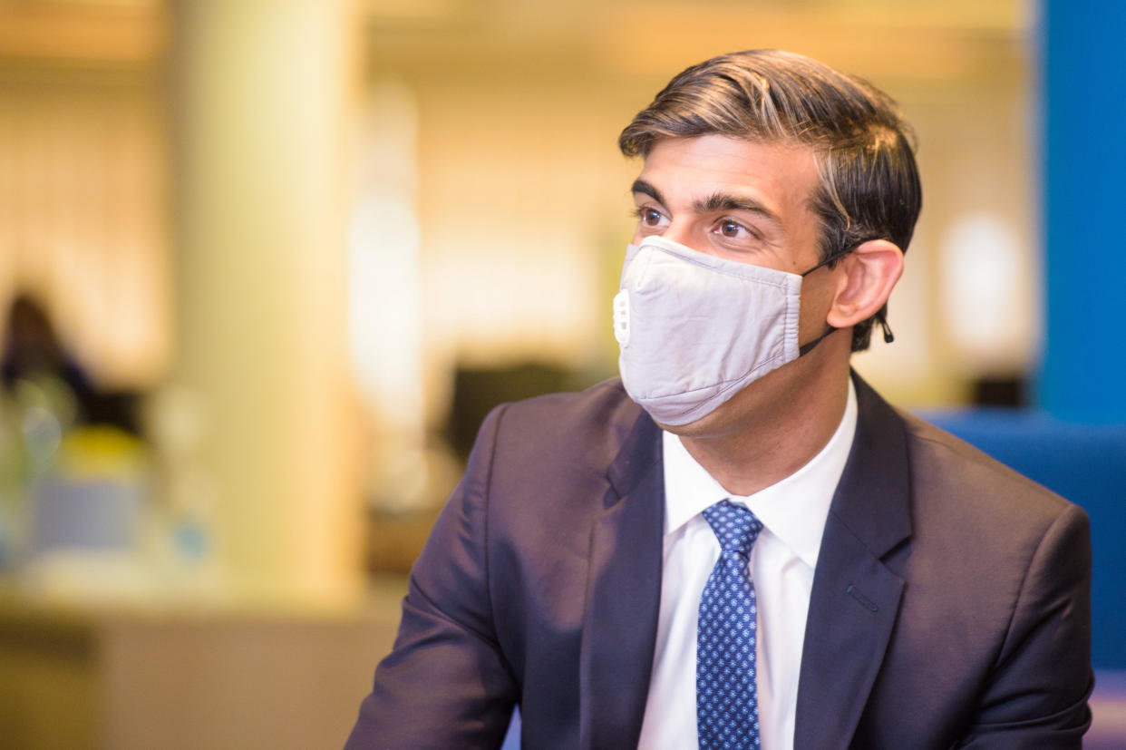 Britain's Chancellor of the Exchequer Rishi Sunak wearing a face mask visits the Jobcentre Plus to see the new support being provided in job centres by the doubling of work coaches, following the coronavirus disease (COVID-19) outbreak in Barking, east London, Britain July 16, 2020. Anthony Upton/Pool via REUTERS