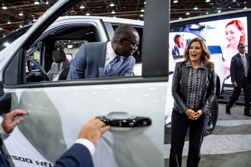 Gov. Gretchen Whitmer stands by as Lt. Gov. Garlin Gilchrist sits in a 2024 Chevrolet Silverado 2500 HD ZR2 while touring the floor during the 2023 North American International Auto Show held at Huntington Place in downtown Detroit on Thursday, Sept. 14, 2023.