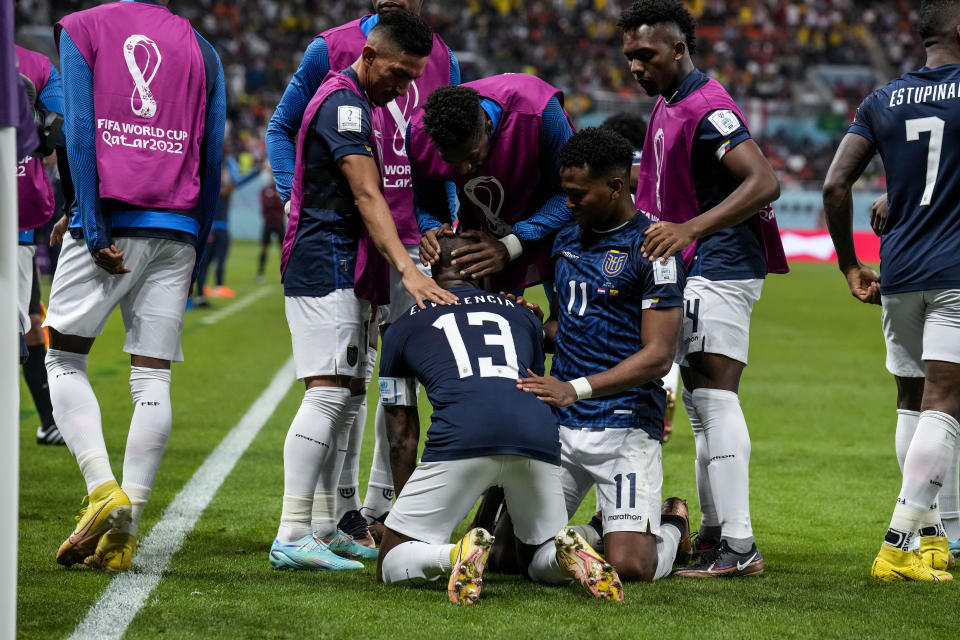 Ecuador's Enner Valencia celebrates with his teammates after scoring his side's first goal during the World Cup group A soccer match between Netherlands and Ecuador, at the Khalifa International Stadium in Doha, Qatar, Friday, Nov. 25, 2022. (AP Photo/Natacha Pisarenko)