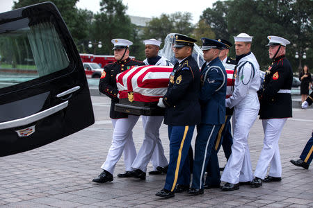 Joint service members of a military casket team carry the casket of Senator John McCain from the US Capitol to a motorcade that will ferry him to a funeral service at the National Cathedral in Washington, DC, USA, 01 September 2018. McCain died 25 August, 2018 from brain cancer at his ranch in Sedona, Arizona, USA. He was a veteran of the Vietnam War, served two terms in the US House of Representatives, and was elected to five terms in the US Senate. McCain also ran for president twice, and was the Republican nominee in 2008. Jim Lo Scalzo/POOL Via REUTERS