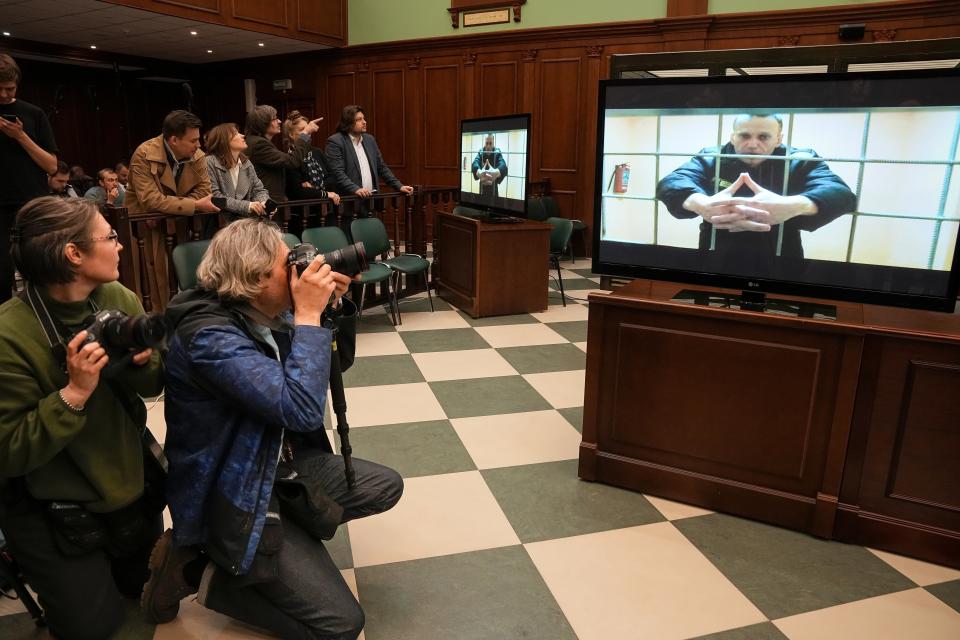 FILE - Russian opposition leader Alexei Navalny appears on a video link from prison provided by the Russian Federal Penitentiary Service at Moscow City Court, Tuesday, May 24, 2022. In a span of a decade, Navalny has gone from the Kremlin's biggest foe to Russia's most prominent political prisoner. Already serving two convictions that have landed him in prison for at least nine years, he faces a new trial that could keep him behind for another two decades. (AP Photo/Alexander Zemlianichenko, File)