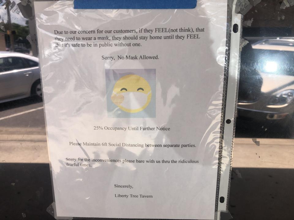 The Liberty Tree Tavern in downtown Elgin has posted a sign outside its entrance cautioning that anyone wearing a mask will not be allowed in.