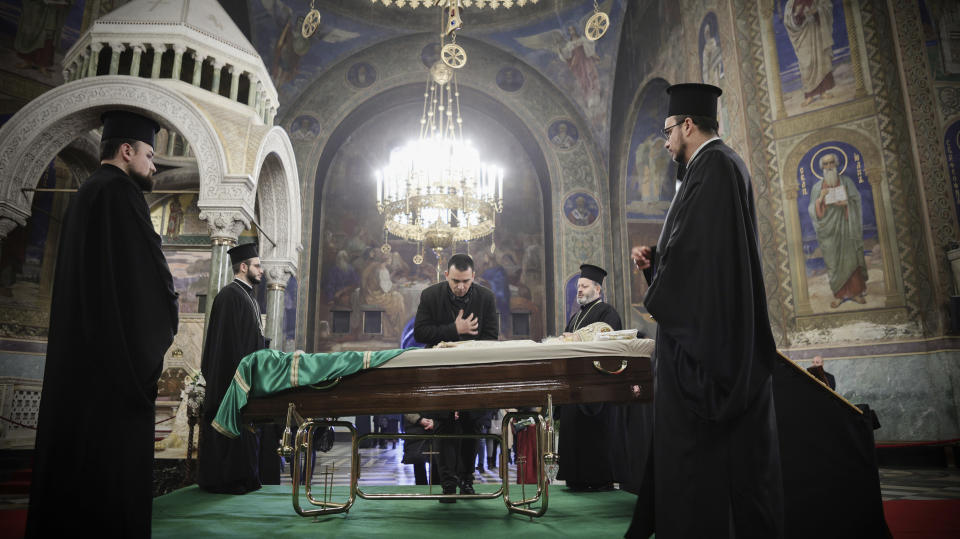 A believer pays his last respects to Bulgarian patriarch Neophyte at the Alexander Nevsky Cathedral in Sofia, Friday, March 15, 2024. National mourning was declared by the Bulgarian government on March 15 and 16 to honour Patriarch Neophyte of Bulgaria. Neophyte who was the first elected head of the Orthodox Church in the post-communist Balkan country, died at a hospital in Sofia on March 13. He was 78. (AP Photo/Valentina Petrova)