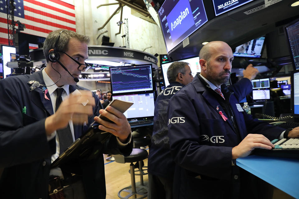 NEW YORK, NY – OCTOBER 15: Traders work on the floor of the New York Stock Exchange (NYSE) on October 15, 2018 in New York City. Following a week of steep losses and modest gains, the Dow Jones Industrial Average was down only slightly in morning trading. (Photo by Spencer Platt/Getty Images)