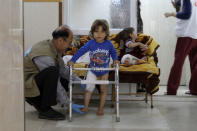 A boy uses crutches to walk during his rehabilitation in a hospital south of Mosul, Iraq, April 11, 2017. Picture taken April 11, 2017. REUTERS/Marko Djurica