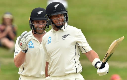 New Zealand's Ross Taylor (right) celebrates reaching his century with Kane Williamson