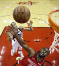 Utah Jazz center Rudy Gobert, left, and Houston Rockets guard Chris Paul (3) reach for a rebound during the first half of Game 5 of a first-round NBA basketball playoff series in Houston, Wednesday, April 24, 2019. (AP Photo/David J. Phillip)