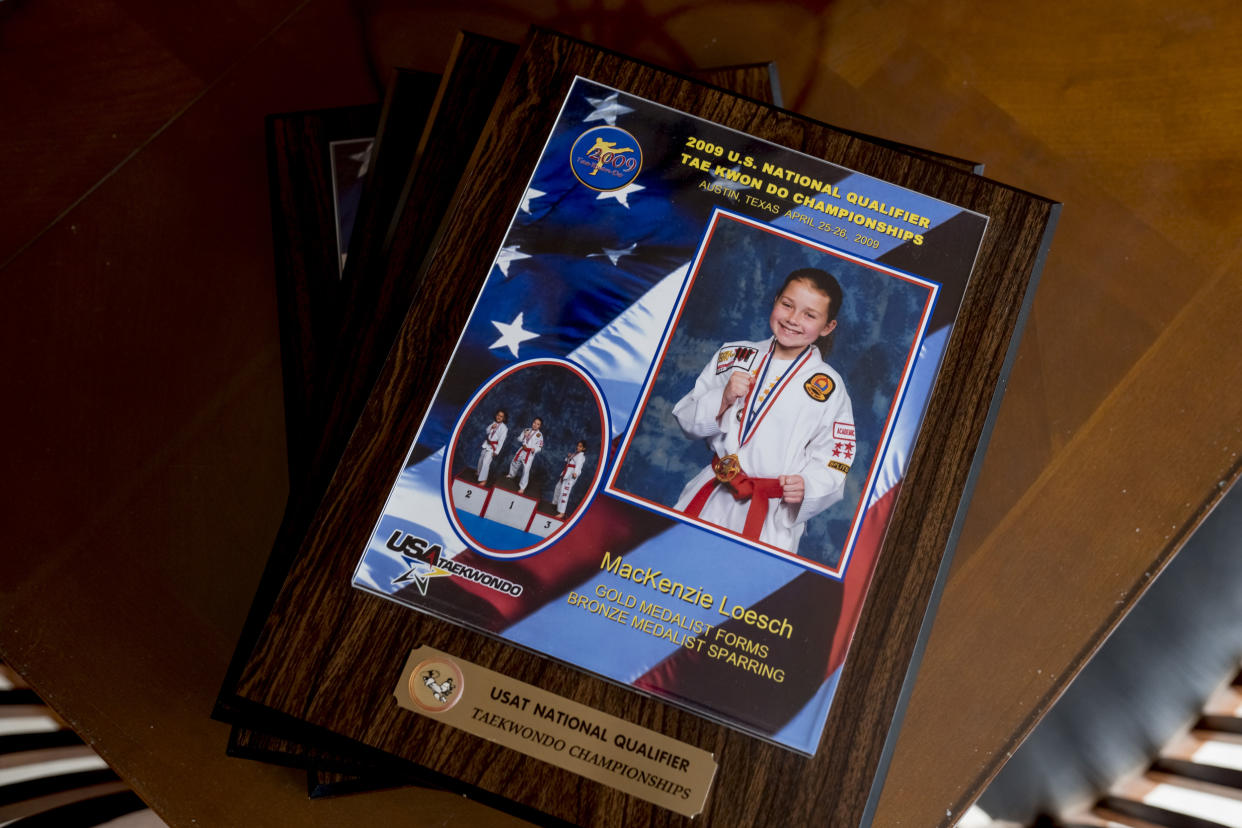 Taekwondo awards belonging to MacKenzie Loesch at her home gym in Marthasville, Mo. (Whitney Curtis for NBC News)