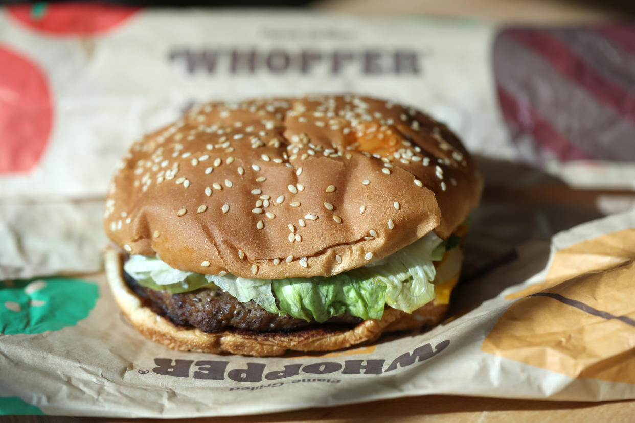 SAN ANSELMO, CALIFORNIA - APRIL 05: In this photo illustration, a Burger King Whopper hamburger is displayed on April 05, 2022 in San Anselmo, California. A federal lawsuit has been filed and is seeking class-action status alleging that fast food burger chain Burger King is misleading customers with imagery that portrays its food, including the Whopper burger, as being much larger than what is actually being served to customers. The lawsuit is being brought by South Florida attorney Anthony Russo. (Photo Illustration by Justin Sullivan/Getty Images)