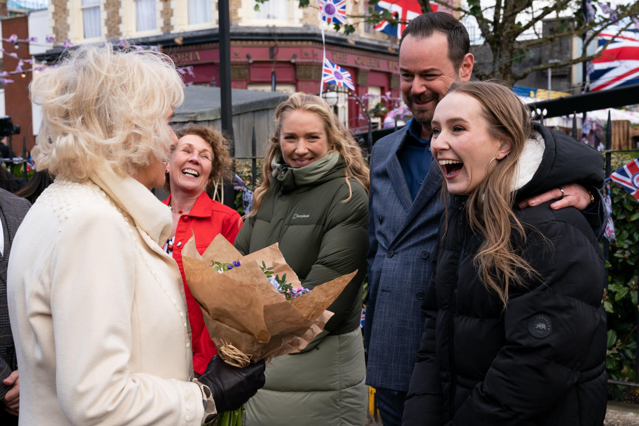 BOREHAMWOOD, ENGLAND - MARCH 31: Camilla, Duchess of Cornwall meets actors (L-R) Jane Slaughter, Maddy Hill, Danny Dyer and Rose Ayling-Ellis during a visit to the set of EastEnders at Elstree Studios on March 31, 2022 in Borehamwood, England. (Photo by Aaron Chown - WPA Pool/Getty Images)