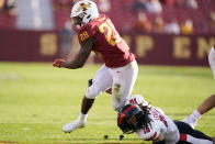 Iowa State running back Breece Hall (28) breaks a tackle by Texas Tech defensive back Thomas Leggett (16) during the second half of an NCAA college football game, Saturday, Oct. 10, 2020, in Ames, Iowa. Iowa State won 31-15. (AP Photo/Charlie Neibergall)