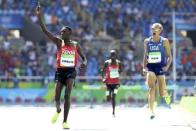 Conseslus Kipruto of Kenya celebrates as he crosses the finish line to win the race REUTERS/Lucy Nicholson