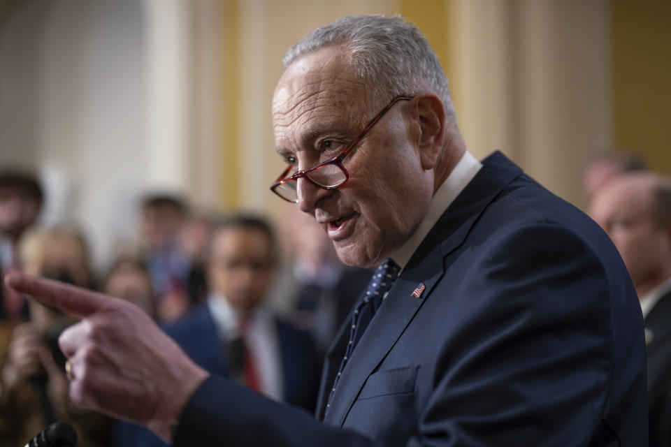 Senate Majority Leader Chuck Schumer, D-N.Y., answers questions on the border security talks as he meets reporters following a Democratic caucus meeting, at the Capitol in Washington, Wednesday, Jan. 31, 2024. (AP Photo/J. Scott Applewhite)