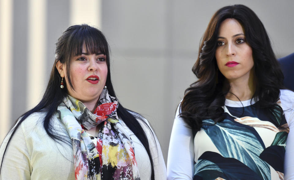 Alleged sexual assault victims, sisters Dassi Erlich, left, and Nicole Meyer speak to the media at Parliament House in Canberra, Australia, Wednesday, Oct. 23, 2019. Australia's Prime Minister Scott Morrison said he will raise with Israel's next administration the need for a quick resolution to a 5-year-old extradition battle over an Israeli educator accused of child sex abuse in an Australian school. (Mick Tsikas/AAP Image via AP)