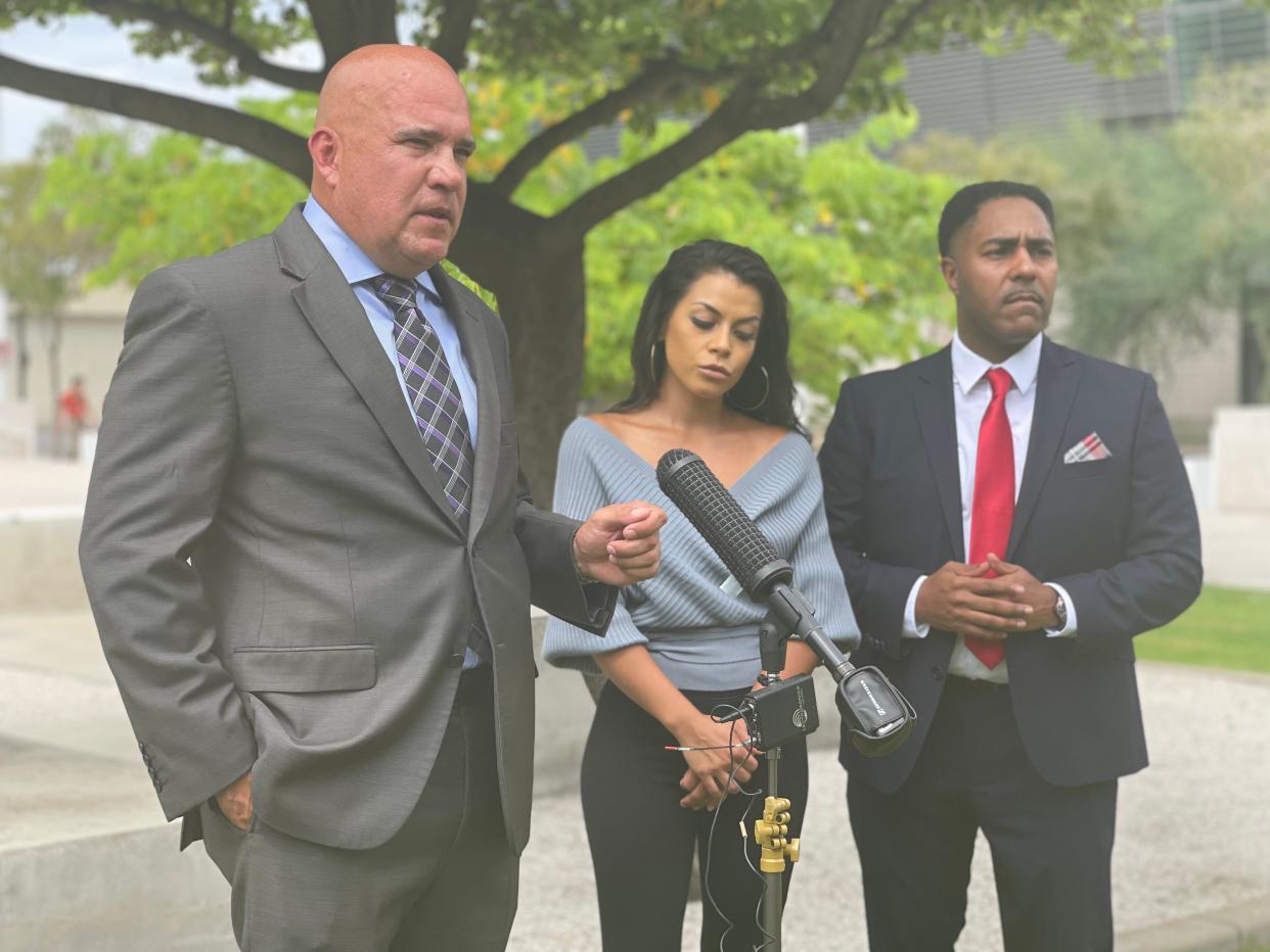 Yessenia Garcia's attorneys, Anthony Ramirez and Benjamin Taylor, speak to reporters on Tuesday.