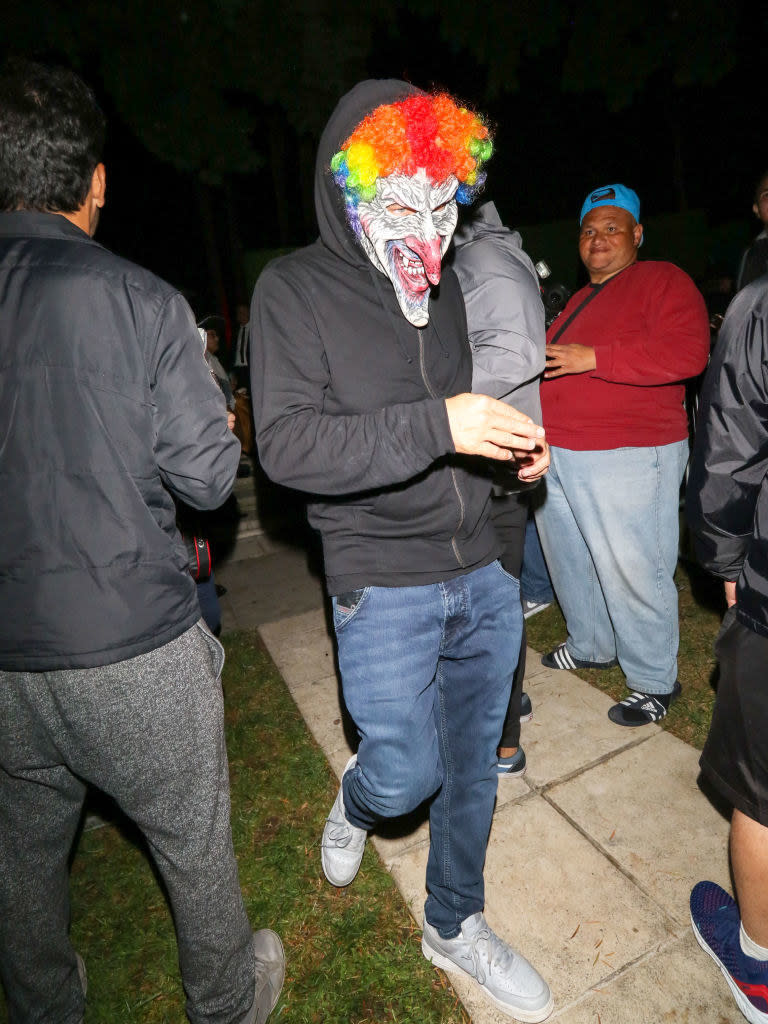 Leo DiCaprio wearing a clown mask