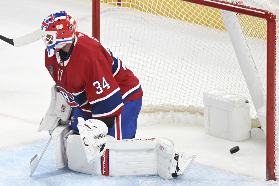 Montreal Canadiens goaltender Jake Allen gives up a goal to New Jersey Devils' Nathan Bastian during the first period of an NHL hockey game Saturday, March 11, 2023, in Montreal. (Graham Hughes/The Canadian Press via AP)