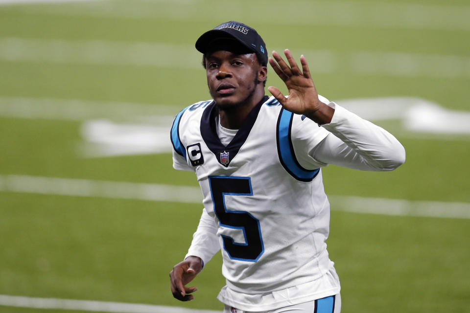 FILE - Carolina Panthers quarterback Teddy Bridgewater (5) waves as he runs off the field after an NFL football game against the New Orleans Saints in New Orleans, in this Sunday, Oct. 25, 2020, file photo. The Carolina Panthers are trading quarterback Teddy Bridgewater to the Denver Broncos, a person familiar with the deal tells The Associated Press. The person, speaking Wednesday, April 28, 2021, on condition of anonymity because neither team has announced the trade, said the Panthers are getting a sixth-round draft pick in return. (AP Photo/Brett Duke, File)