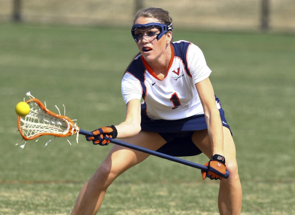 FILE - In a March 8, 2009, photo, University of Virginia women?s lacrosse player Yeardley Love works with the ball in Charlottesville, Va. Nearly 12 years after Love was found dead, George Huguely, convicted of second-degree murder in her killing is headed back to court for a civil trial. Jury selection is expected in Charlottesville Circuit Court Monday, April 25, 2022 in a trial that will seek to hold George Huguely V liable in the death of Love. (AP Photo/The Daily Progress, Andrew Shurtleff, File)