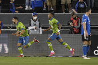 Seattle Sounders midfielder Cristian Roldan, left, reacts after scoring a goal against the San Jose Earthquakes as he is followed by teammate Xavier Arreaga (3) during the second half of an MLS soccer match Wednesday, Sept. 29, 2021, in San Jose, Calif.(AP Photo/Tony Avelar)