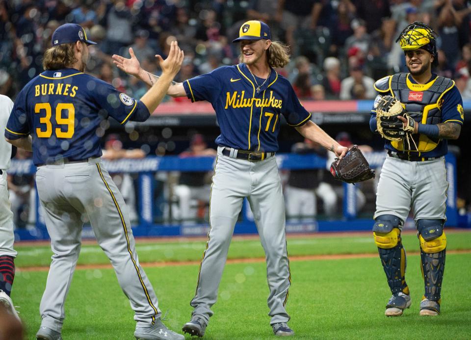 Milwaukee Brewers closer Josh Hader and starting pitcher Corbin Burnes celebrate their combined no-hitter against Cleveland as catcher Omar Narváez is all smiles after the team's 3-0 victory on Saturday, Sept. 11, 2021, at Progressive Field. It was the team's first no-hitter since 1987.