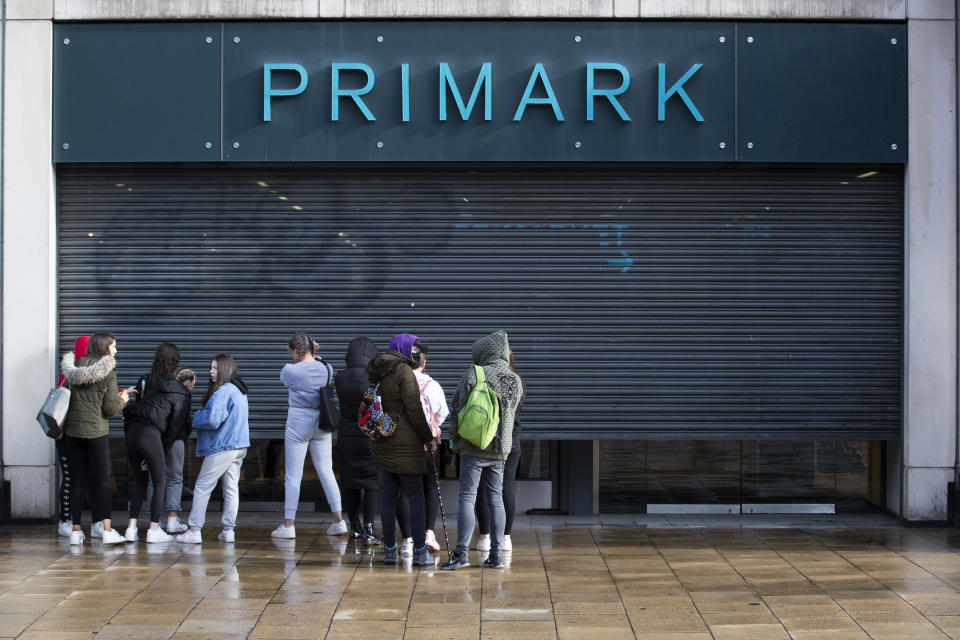 People queue outside the Primark store on Princes Street in Edinburgh, which reopens today as part of Scotland's phased plan to ease out of the coronavirus pandemic lockdown. (Photo by Jane Barlow/PA Images via Getty Images)