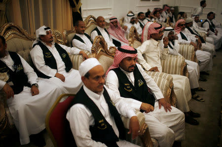 Employees attend a meeting in a factory that makes Kiswa, a silk cloth covering the Holy Kaaba, ahead of the annual haj pilgrimage, in the holy city of Mecca, Saudi Arabia August 26, 2017. Picture taken August 26, 2017. REUTERS/Suhaib Salem