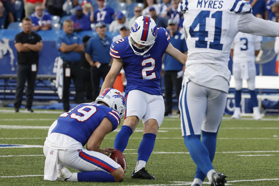 Buffalo Bills placekicker Tyler Bass (2) boots the winning field goal as punter Matt Araiza (19) releases the ball while Indianapolis Colts cornerback Alexander Myres (41) tries to defend in the second half of a preseason NFL football game, Saturday, Aug. 13, 2022, in Orchard Park, N.Y. (AP Photo/Jeffrey T. Barnes)