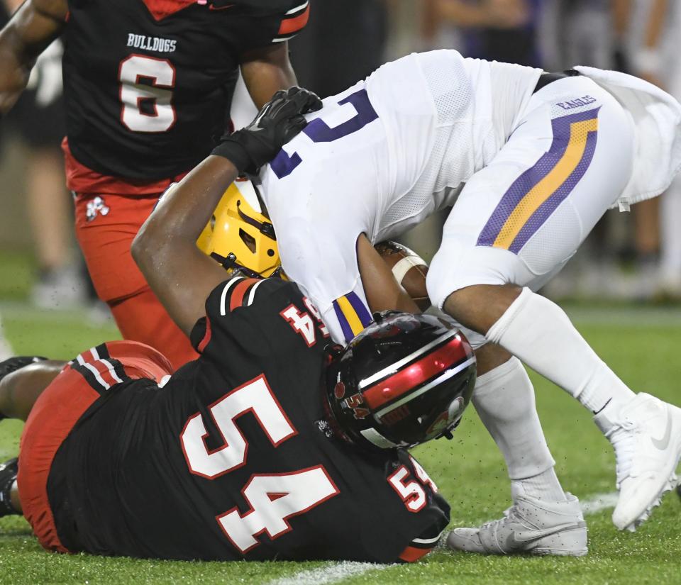 McKinley's Dior Garner brings down Avon's Jakorion Caffey in the third quarter, Friday, Aug. 25, 2023.