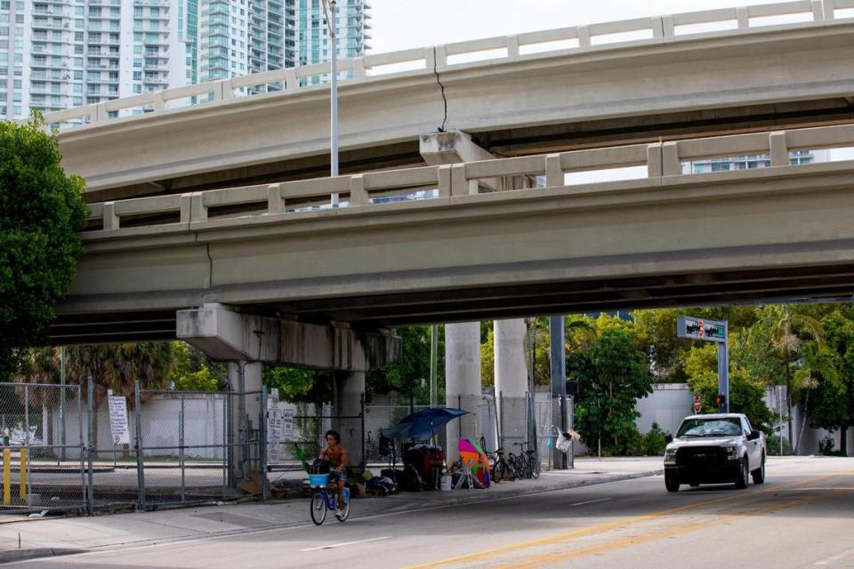 Makeshift beds and living quarters can be seen underneath Interstate 95 near Southwest First Street in September.